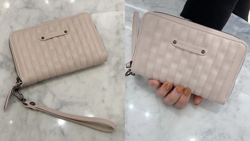 LONGCHAMP 粉色手掛式拉鍊小皮夾，NT9,900