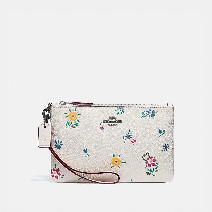 Coach 狂野花卉印花小型手腕包，NT4,500