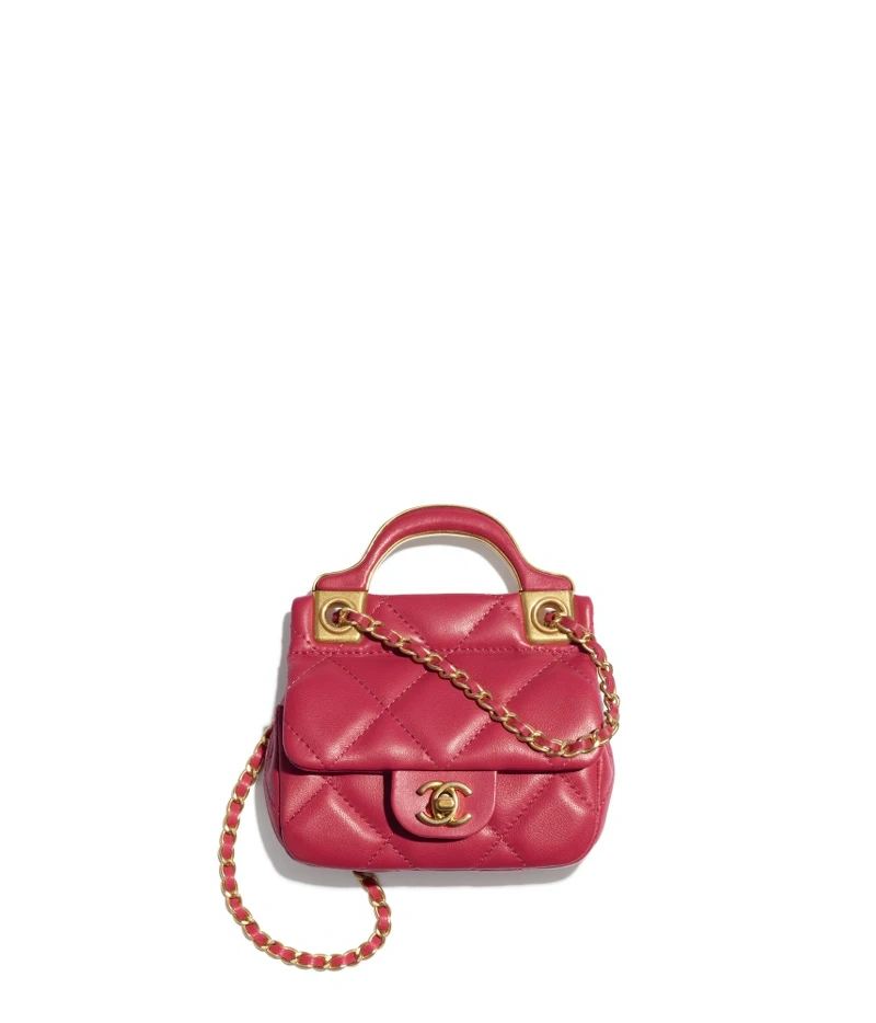 Chanel桃紅皮革菱格紋金屬皮穿鍊飾以手把小包，NT70,900