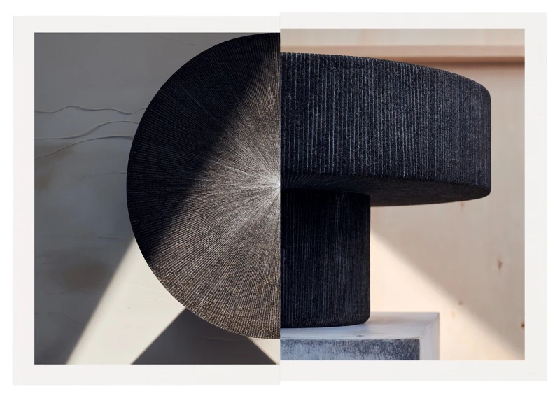 有著灰色石料材質的 Lignage d’Hermès 系列石桌。