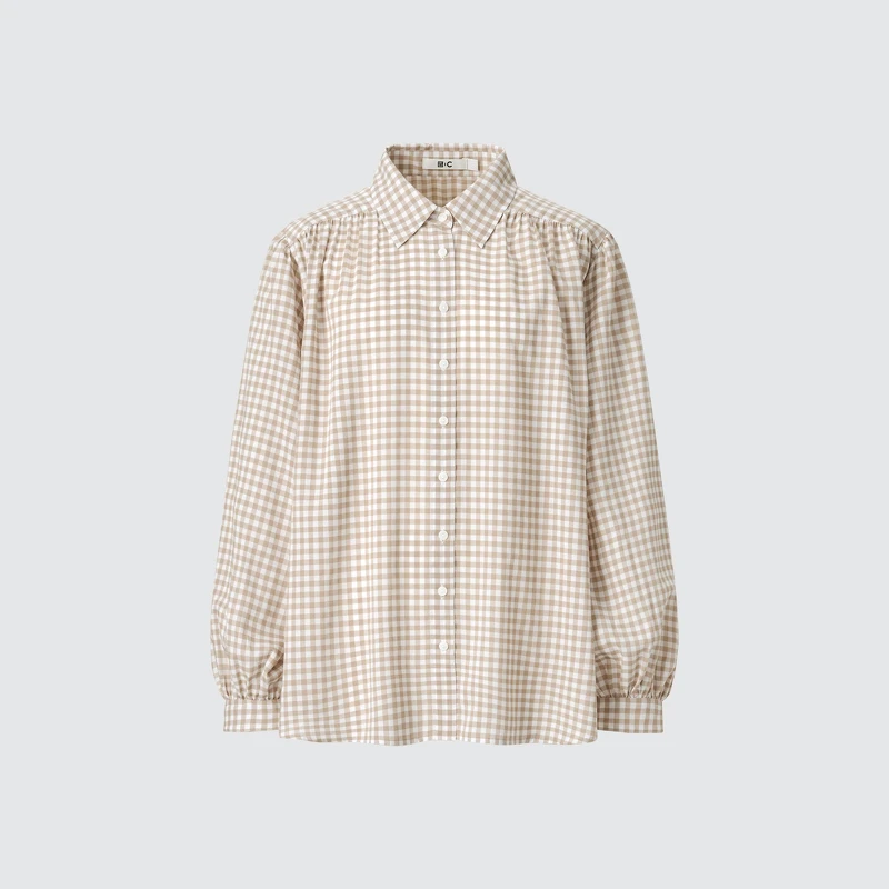 透膚澎袖抓皺上衣NT$990。