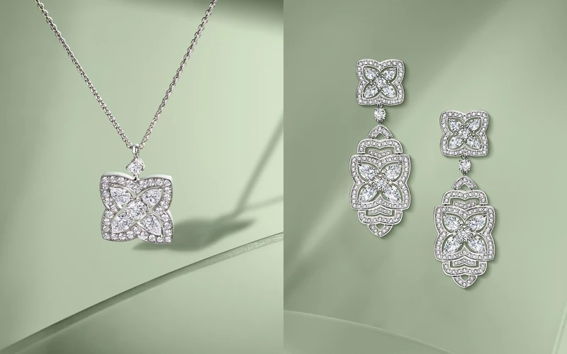 （左起）Enchanted Lotus 18K白金鑽石吊墜項鍊，由梨形切割鑽石和密鑲圓形明亮式切割鑽石打造而成；Enchanted Lotus高級珠寶鑽石雞尾酒耳環，鑽石總重約5.47克拉，De Beers。