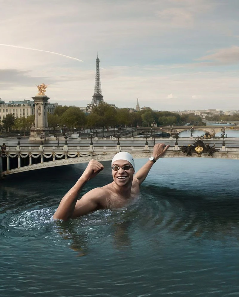 影片從法國游泳選手 Léon Marchand 準備從巴黎高空蹬腿一躍揭開序幕。 影片從法國游泳選手 Léon Marchand 準備從巴黎高空蹬腿一躍揭開序幕。