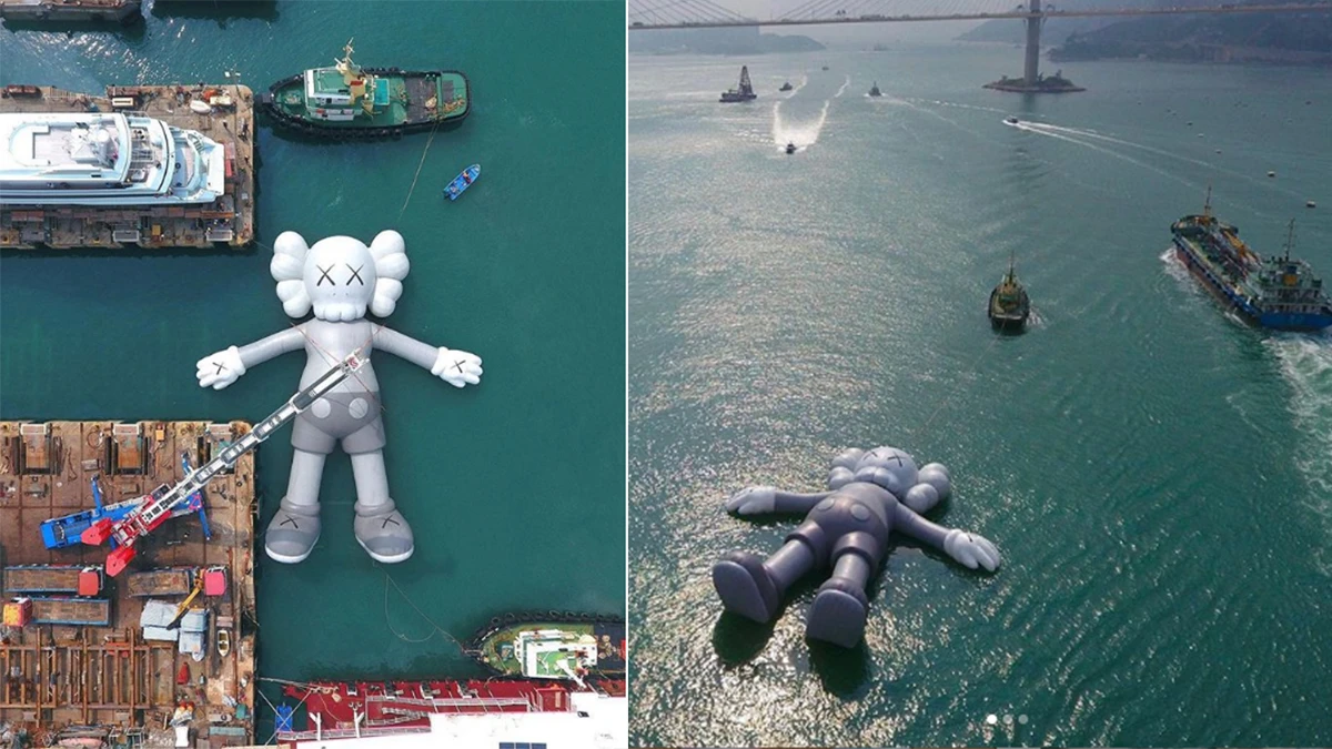 太悠閒啦~跟著 KAWS 公仔一起漂浮在香港維多利亞港