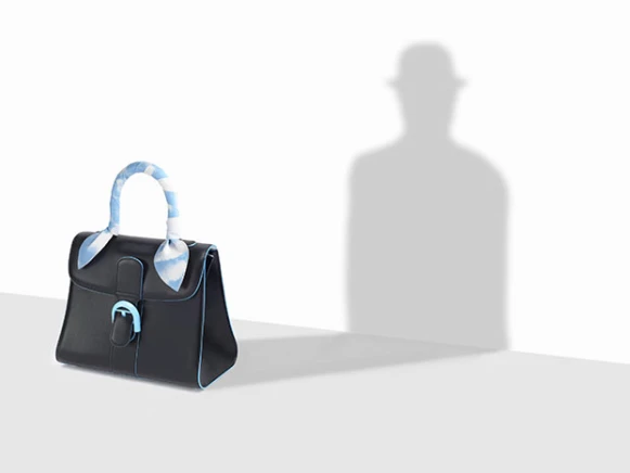 顛覆傳統的精緻工藝 Delvaux 帶你遨遊畫家馬格利特的超現實夢境